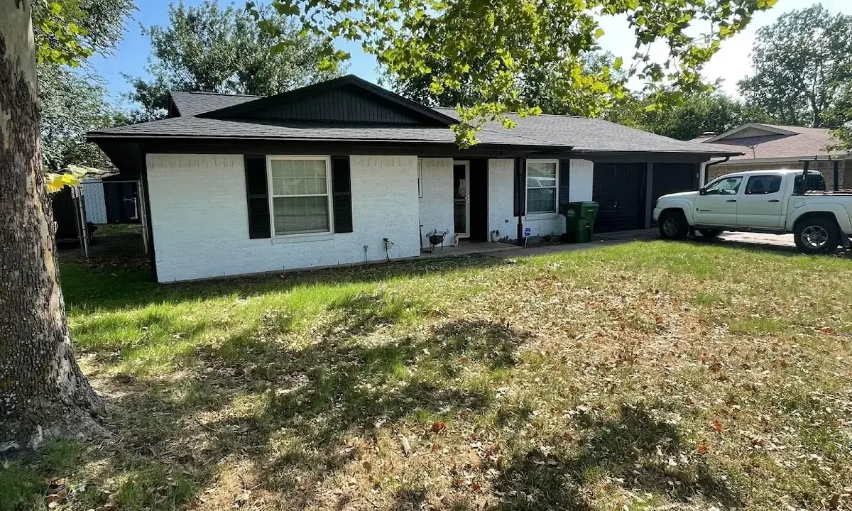 Professional roofing crew working on a residential roof in Moyock